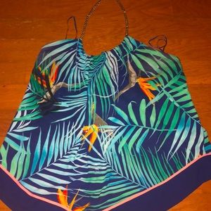 halter top , ties in the back , long in the front